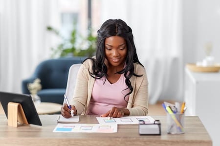 Woman creating prototype to become a UX designer